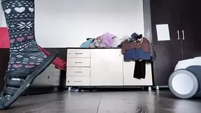 Amateur mom cleans naked with vacuum cleaner in the house.