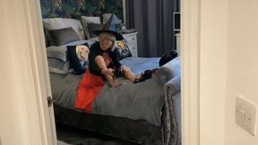 Smoking on bed in Halloween costume