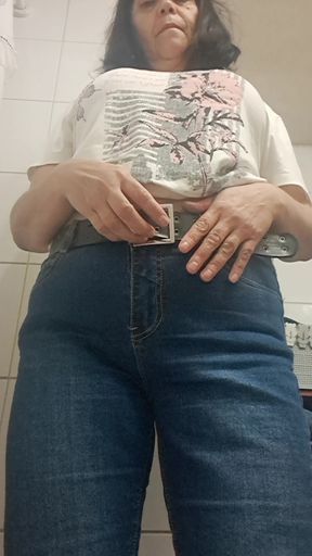 MILF taking off her clothes, urinating, leaving her vagina wet and hot.