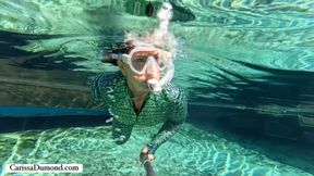 Carissa snorkeling and freediving in the crocodile catsuit in the spring