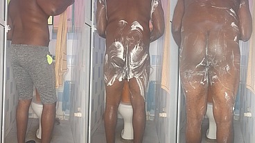 African giant fingering his tight anus while bathing