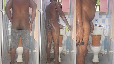 African giant fingering his tight anus while bathing