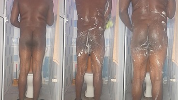 African giant fingering his tight anus while bathing