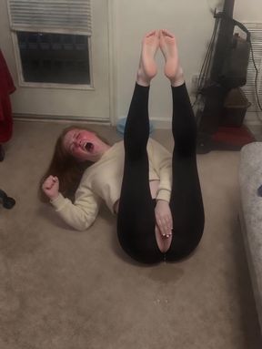 Girl doing handstand on floor