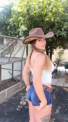 Western cowgirl in jean shorts