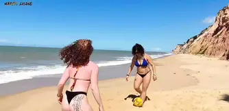 Playing soccer on the beach two hotties lost the bet and had to me