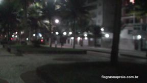 Friends show off at night on the beach promenade