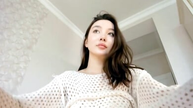 Korean woman pleasures herself with a black vibrator on webcam