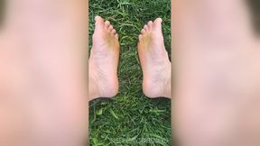 Feet flexing in the grass