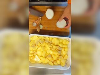 Peeling 'em Potatoe and greasing BACoN