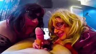Crossdressers in glasses suck a big cock in threesome