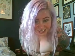 Tattooed big breasted webcam blondie plays with her huge boobies