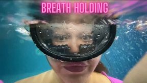 diving underwater and holding breath