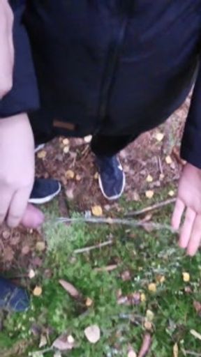 Girlfriend enjoying holding my cock while I pee - playing with her hand in my warm piss