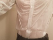 Taking a shower while crossdressing. (pink bra is seen through the blouse)