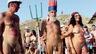 Naked women and men are having fun at Neptune nudist beach