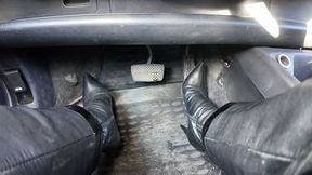 driving in leather high heel boots and leather outfit