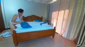 Nudist housekeeper Regina Noir makes the bedding in the bedroom  Naked maid  Naked housewife  1