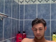 Boy baths & washes feet