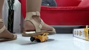 crushing a toyset with 3 construction truck in nylons and 3 sexy sandals