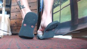 Very worn black flipflops