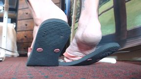 Very worn black flipflops