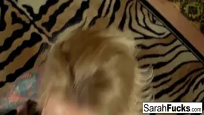 Blonde bombshell Sarah Jessie takes off her top to reveal her enormous natural breasts