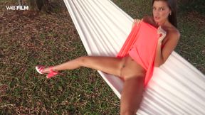 Maria Rya toys her soaking wet pussy lying in a hammock