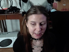 Sexy kitty eats from a bowl and licks her master's feet -