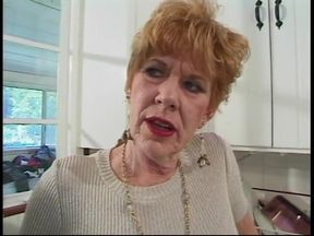 Younger guy gets blown by 70 year old redhead in kitchen