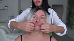 giving her BIG fish lips and pinching her stretchy face a