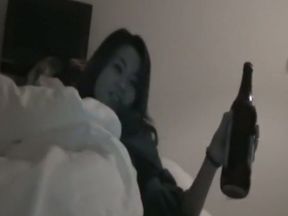 Dark-haired Chinese nympho stuffs her pussy with a bottle
