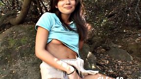 Tempting teen finger fucks her shaved pussy outside