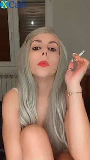 Blond Teeny smoked before fucking herself with a dildo