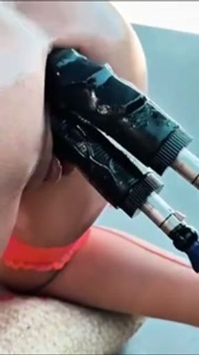 Sex Slave being DP'ed by a huge dildo on a fuckmachine, oudoor on a sunny day.