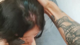Punching her hard in the throat until she cries