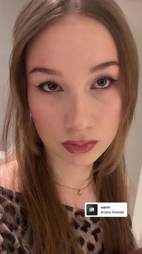 Young Swedish girl with lipstick shows off her lips