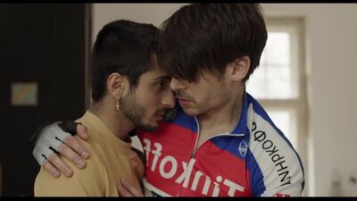 Two horny gay dudes are passionately kissing and making out