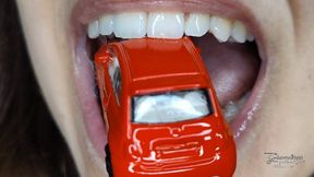 Licking a tiny car