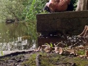 Stripping down naked inside a forest stroking my big skinny Cock at a lake and dipping my feet in