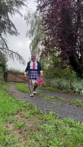 Dressed in a little pink plaid skirt for a party