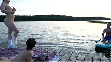 SUP instructor fucks two horny girls right next to the lake