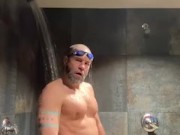 Bearded Swimmer pissing in locker room