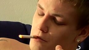 Tomy cant help rubbing his throbbing cock while smoking