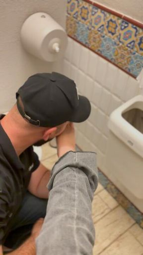 an obedient man in a restaurant restroom