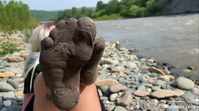 Goddess shows you her messy nylon feet close ups in torn pantyhose on the river bank