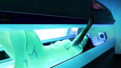 Tattooed girl lets stranger control her Lovense toy while tanning naked