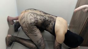 Masked solo in Fishnets Riding a Wall-Mounted Dildo