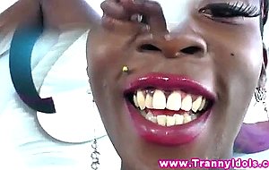 Ebony tranny penetrates her ass with toy