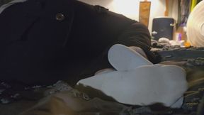 Chrissy candid resting feet in socks on bed